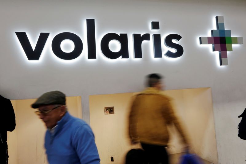 &copy; Reuters. FILE PHOTO: Passengers walk past the logo of Mexican low-cost air carrier Volaris at Benito Juarez International Airport in Mexico City, Mexico January 10, 2018. Picture taken January 10, 2018. REUTERS/Daniel Becerril