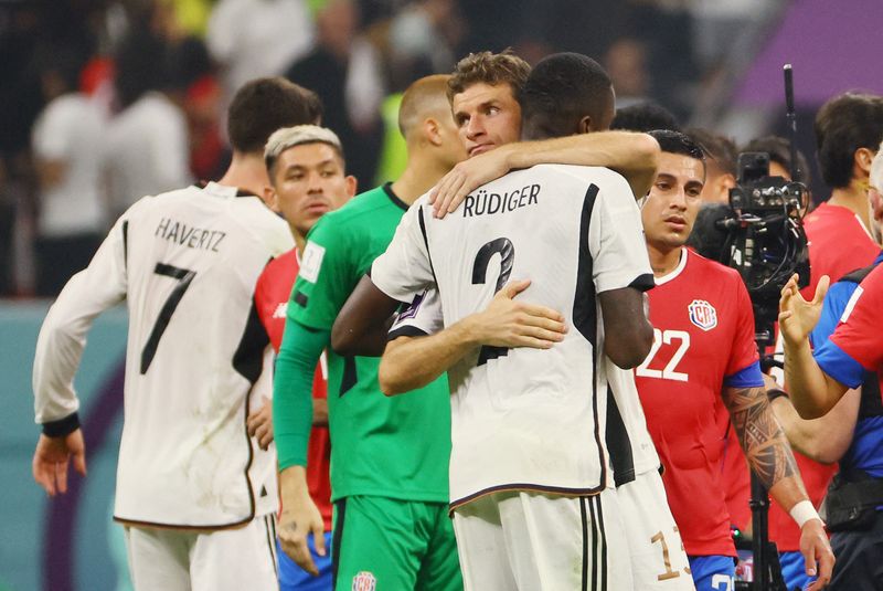 © Reuters. Soccer Football - FIFA World Cup Qatar 2022 - Group E - Costa Rica v Germany - Al Bayt Stadium, Al Khor, Qatar - December 1, 2022 Germany's Thomas Muller and Antonio Rudiger look dejected after the match as Germany are eliminated from the World Cup REUTERS/Wolfgang Rattay