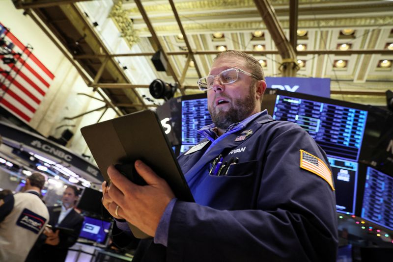 &copy; Reuters. FILE PHOTO: A trader works on the floor of the New York Stock Exchange (NYSE) in New York City, U.S., December 5, 2022.  REUTERS/Brendan McDermid