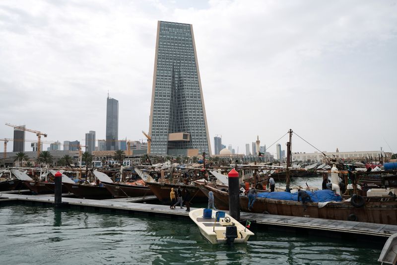 &copy; Reuters. FILE PHOTO: The Kuwait Central Bank towers over the traditional Dhow harbor in Kuwait City, Kuwait March 18, 2020. REUTERS/Stephanie McGehee