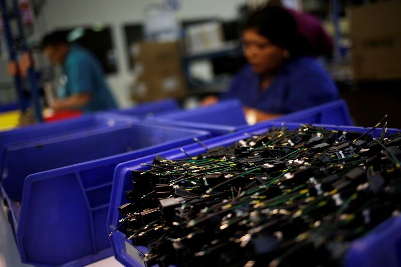 &copy; Reuters. An operator works at a wire harness and cable manufacturing plant as the fast-spreading coronavirus outbreak has rippled through the global economy and upended supply chains, in Ciudad Juarez, Mexico March 11, 2020. REUTERS/Jose Luis Gonzalez/File Photo