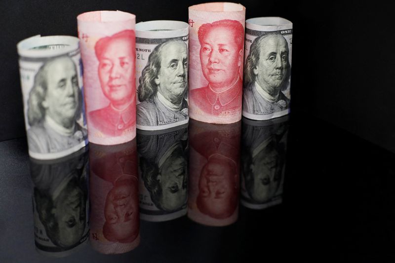 © Reuters. FILE PHOTO: Banknotes of Chinese yuan and U.S. dollar are seen in this illustration picture taken September 29, 2022. REUTERS/Florence Lo/Illustration