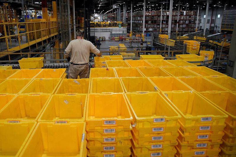 &copy; Reuters. FILE PHOTO: A worker organizes empty bins during Cyber Monday at the Amazon fulfillment center in Robbinsville Township in New Jersey, U.S., November 28, 2022. REUTERS/Eduardo Munoz/File Photo