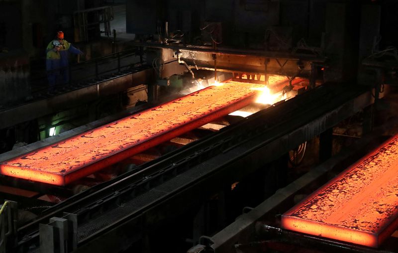 &copy; Reuters. FILE PHOTO: Red-hot steel plates pass through a press at the Tata steel plant in Ijmuiden, Netherlands April 3, 2019. REUTERS/Yves Herman/File Photo