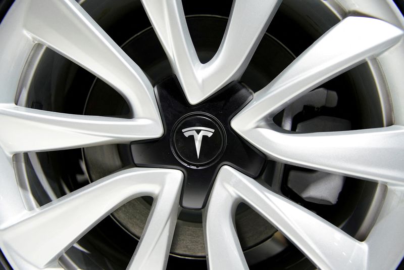 &copy; Reuters. FILE PHOTO: A Tesla logo is seen on a wheel rim during the media day for the Shanghai auto show in Shanghai, China April 16, 2019. REUTERS/Aly Song/File Photo/File Photo