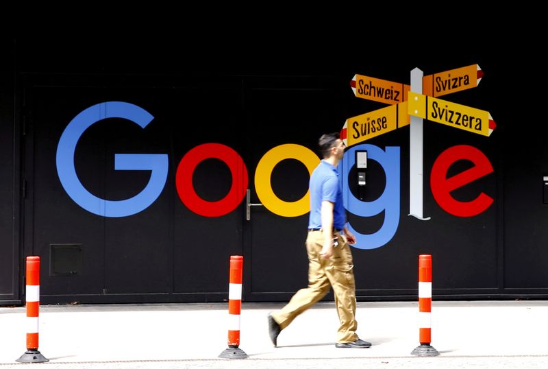 &copy; Reuters. FILE PHOTO: A man walks past a logo of Alphabet Inc's Google in front of at an office building in Zurich, Switzerland July 1, 2020.   REUTERS/Arnd Wiegmann/File Photo