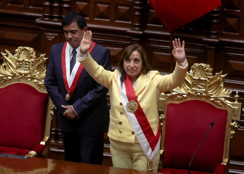 &copy; Reuters. Peru's interim President Dina Boluarte, who was called on by Congress to take the office after the legislature approved the removal of President Pedro Castillo in an impeachment trial, waves after being sworn-in, in Lima, Peru December 7, 2022. REUTERS/Se