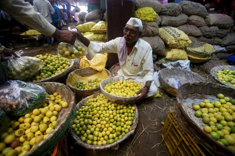 &copy; Reuters. A vendor sells lemons at a wholesale market in Mumbai, India, June 14, 2018. REUTERS/Francis Mascarenhas/Files