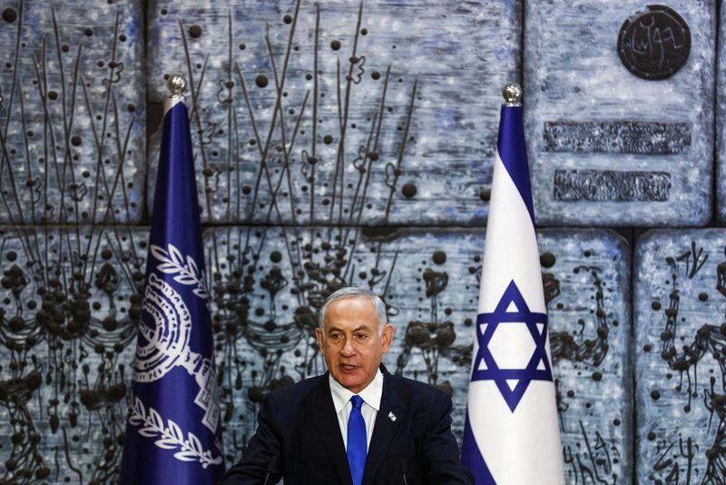 © Reuters. FILE PHOTO: Benjamin Netanyahu speaks during a ceremony where Israel President Isaac Herzog handed him the mandate to form a new government following the victory of the former premier's right-wing alliance in this month's election at the President's residency in Jerusalem November 13, 2022. REUTERS/ Ronen Zvulun/File Photo