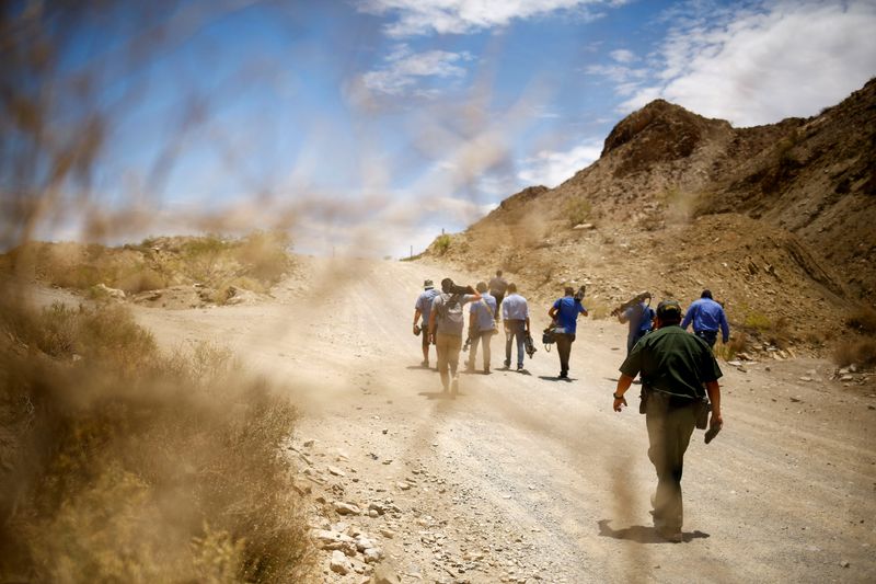 &copy; Reuters. FILE PHOTO: A U.S. Border Patrol agent walks with media representatives during the 'Dangers of Crossing the Border' event, to warn of the dangers of illegally crossing the border between Mexico and the United States, in Sunland Park, New Mexico, U.S., Jun