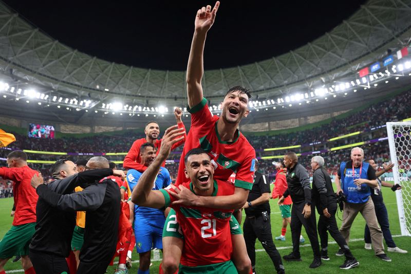 &copy; Reuters. Soccer Football - FIFA World Cup Qatar 2022 - Quarter Final - Morocco v Portugal - Al Thumama Stadium, Doha, Qatar - December 10, 2022 Morocco's Achraf Dari and Morocco's Walid Cheddira celebrate after the match as Morocco progress to the semi finals REUT