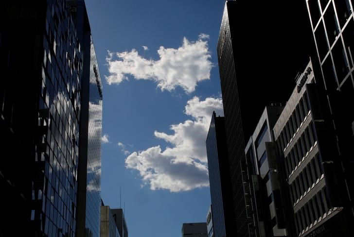 &copy; Reuters. 　日銀が１２日発表した１１月の企業物価指数（ＣＧＰＩ）速報によると、国内企業物価指数は前年比９．３％上昇した。写真は２０１７年２月に撮影した都内のオフィスビル（２０２２年