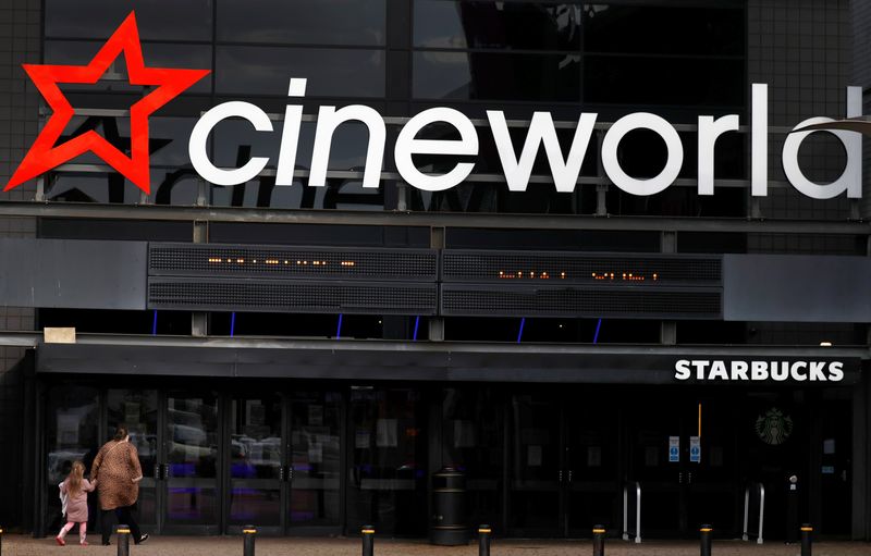&copy; Reuters. FILE PHOTO: People enter a Cineworld cinema following the outbreak of the coronavirus disease (COVID-19) near Manchester, Britain, October 4, 2020. REUTERS/Phil Noble