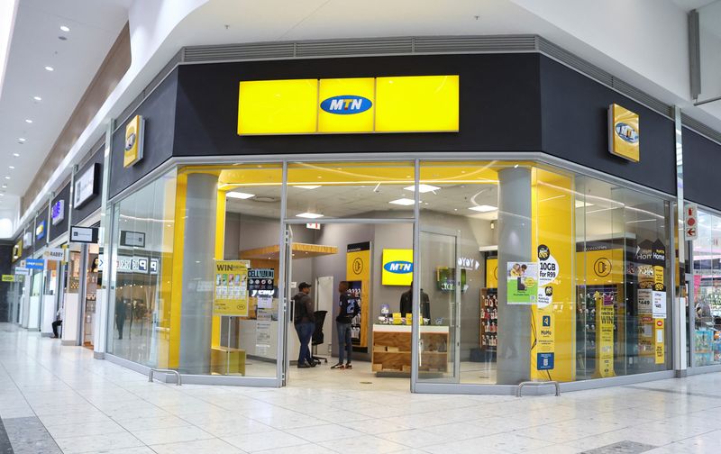 &copy; Reuters. FILE PHOTO: Customers are seen at an outlet of South Africa's MTN Group at the Mall of the South in Johannesburg, South Africa, November 4, 2022. REUTERS/Siphiwe Sibeko