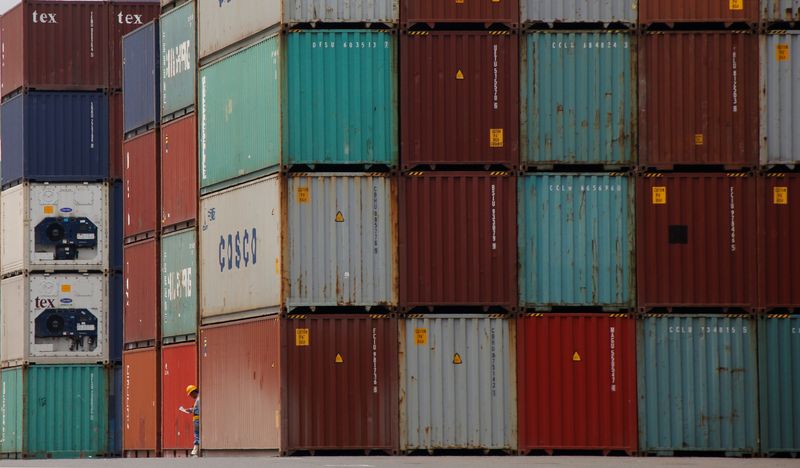 &copy; Reuters. FILE PHOTO: A laborer works in a container area at a port in Tokyo, Japan July 19, 2017. Picture taken July 19, 2017. REUTERS/Toru Hanai