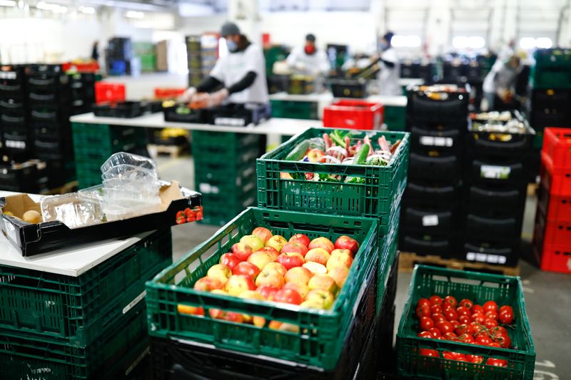 &copy; Reuters. Members of the food bank "Berliner Tafel" collect food from the wholesale market, to distribute it later by bicycle to needy people, as the spread of the coronavirus disease (COVID-19) continues in Berlin, Germany, April 3, 2020. REUTERS/Axel Schmidt/File