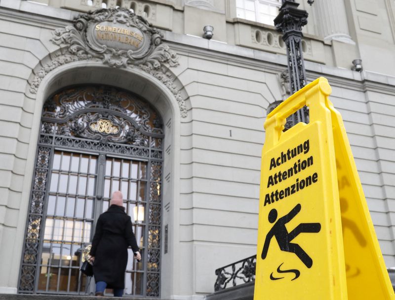 &copy; Reuters. FILE PHOTO: A sign is placed in front of the entrance of the Swiss National Bank (SNB) in Bern, Switzerland December 15, 2022. REUTERS/Arnd Wiegmann