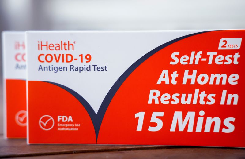 © Reuters. FILE PHOTO: Take home COVID-19 self testing kits provided by the District of Columbia government, which provides city residents four free take home tests per day, are seen in this illustration taken January 11, 2022. REUTERS/Evelyn Hockstein/Illustration