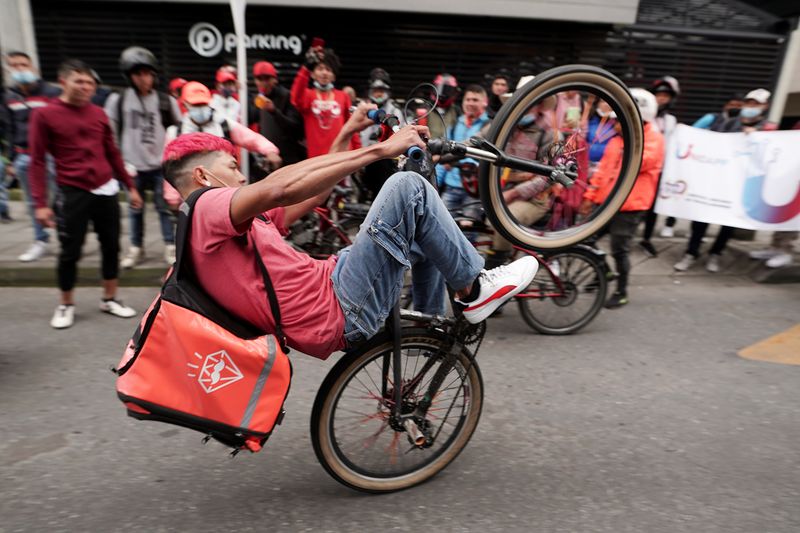 &copy; Reuters. A delivery worker rides a bike as delivery workers for Rappi and other delivery apps protest as part of a strike to demand better wages and working conditions, in Bogota, Colombia March 2. 2022. REUTERS/Nathalia Angarita/File Photo