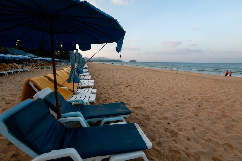 &copy; Reuters. FILE PHOTO: Empty chairs are seen on a beach which is usually full of tourists, amid fear of coronavirus in Phuket, Thailand March 11, 2020. REUTERS/Soe Zeya Tun