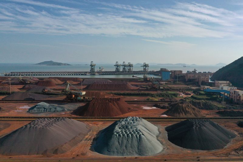 &copy; Reuters. FILE PHOTO: Piles of imported iron ore are seen at a port in Zhoushan, Zhejiang province, China May 9, 2019. Picture taken May 9, 2019. REUTERS/Stringer 