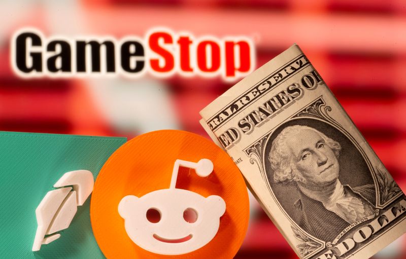 &copy; Reuters. FILE PHOTO: A 3d printed Robinhood and Reddit logos are seen near one dollar banknotes in front of displayed GameStop logo in this illustration taken February 8, 2021. REUTERS/Dado Ruvic/Illustration/File Photo