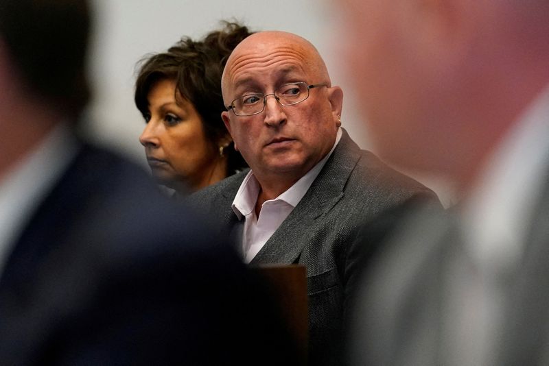 &copy; Reuters. FILE PHOTO: Robert E. Crimo III's mother Denise Pesina and father Robert Crimo Jr. attend a hearing for their son in Lake County court, in Waukegan, Illinois, U.S., August 3, 2022. Nam Y. Huh/Pool via REUTERS