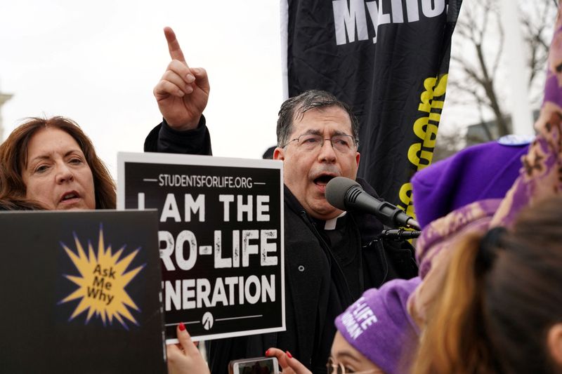 © Reuters. FILE PHOTO: Father Frank Pavone, national director of Priests for Life, speaks in front of the U.S. Supreme Court during the March for Life in Washington, U.S. January 24, 2020.  REUTERS/Gregory A. Shemitz