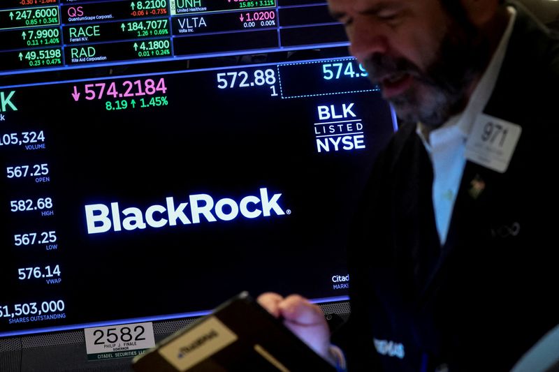 &copy; Reuters. FILE PHOTO: A trader works as a screen displays the trading information for BlackRock on the floor of the New York Stock Exchange (NYSE) in New York City, U.S., October 14, 2022. REUTERS/Brendan McDermid
