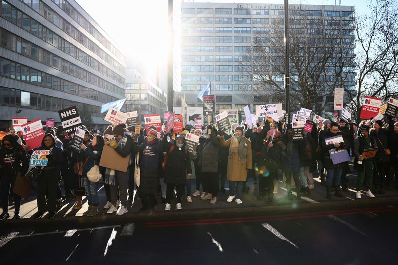 &copy; Reuters. NHS nurses cast shadows as they strike, amid a dispute with the government over pay, outside St Thomas' Hospital in London, Britain December 15, 2022. REUTERS/Henry Nicholls/Files
