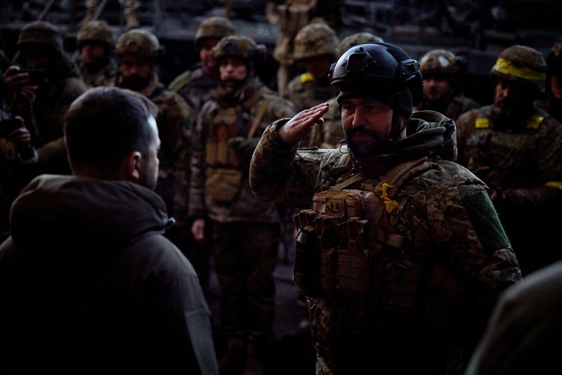 &copy; Reuters. Ukraine's President Volodymyr Zelenskiy visits Ukrainian service members at their position in the frontline town of Bakhmut, amid Russia's attack on Ukraine, in Donetsk region, Ukraine December 20, 2022. Ukrainian Presidential Press Service/Handout via RE