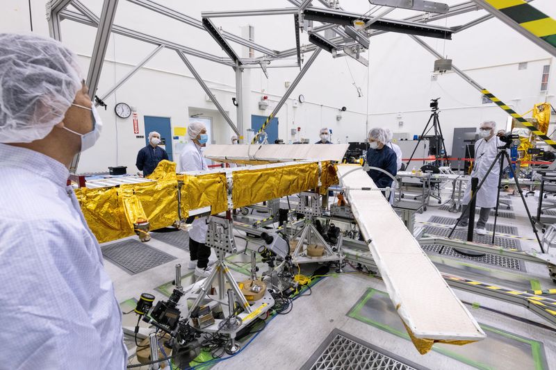 &copy; Reuters. FILE PHOTO: Members of the international Surface Water and Ocean Topography (SWOT) radar satellite mission test one of the antennas for the Ka-band Radar Interferometer (KaRIn) instrument in a clean room at NASA's Jet Propulsion Laboratory in Pasadena, Ca