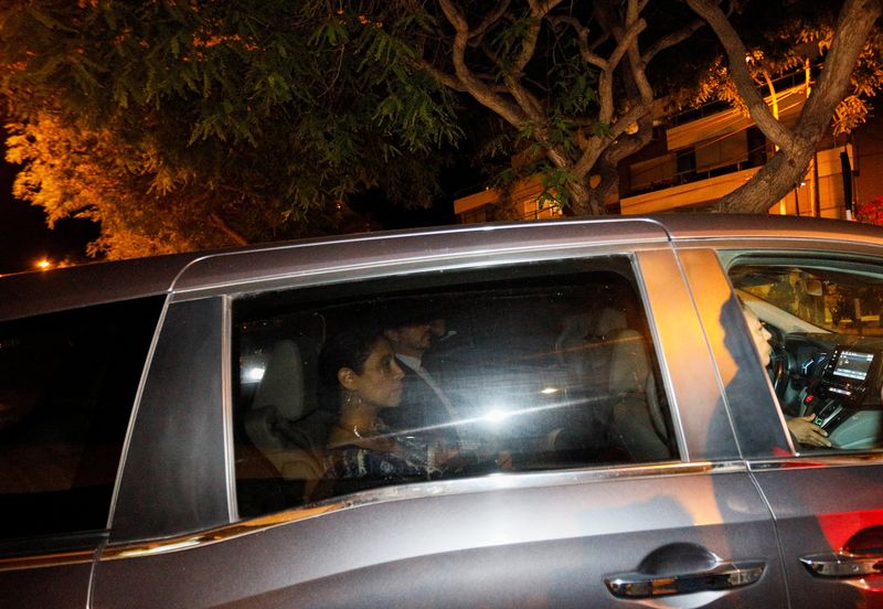 © Reuters. Police stand guard as a vehicle leaves the residence of Mexico's ambassador, after Peru declared Mexico's top diplomat to Lima 