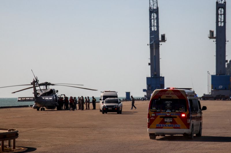 &copy; Reuters. A helicopter carries an injured sailor and a body of a Royal Thai Navy sailor during a rescue mission after a Navy corvette sank in the Gulf of Thailand, in Prachuap Khiri Khan province, December 21, 2022. REUTERS/Napat Wesshasartar