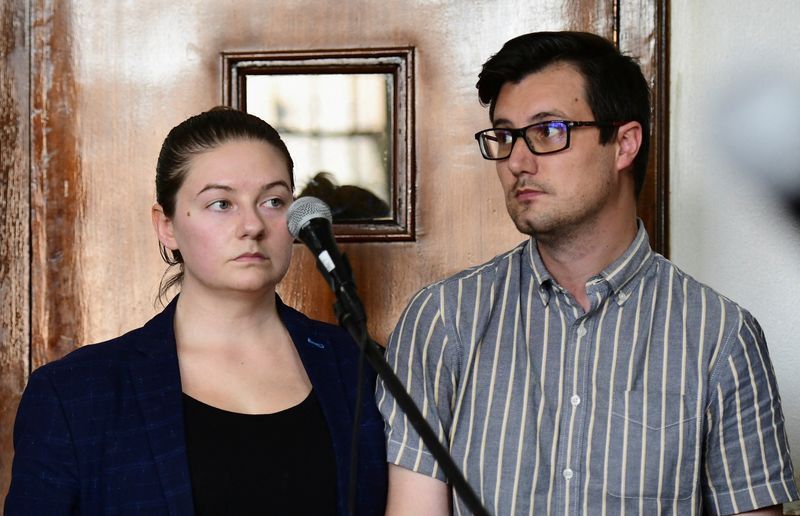 &copy; Reuters. FILE PHOTO: American couple Nicholas Spencer and his wife, Mackenzie Leigh Mathias Spencer, both 32, stand in the dock at Buganda road court, where they were charged with torturing a ten year old John Kayima and state prosecutor objected to their applicat