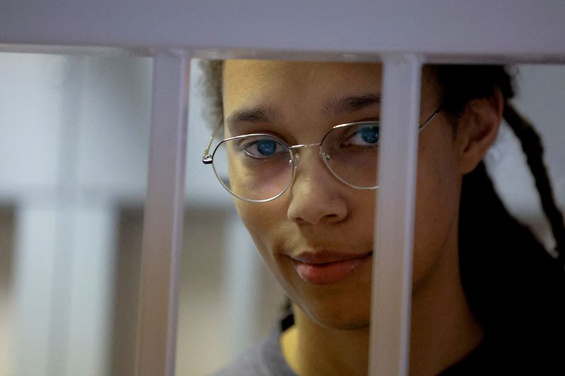 &copy; Reuters. FILE PHOTO: U.S. basketball player Brittney Griner, who was detained at Moscow's Sheremetyevo airport and later charged with illegal possession of cannabis, stands inside a defendants' cage before a court hearing in Khimki outside Moscow, Russia August 4,