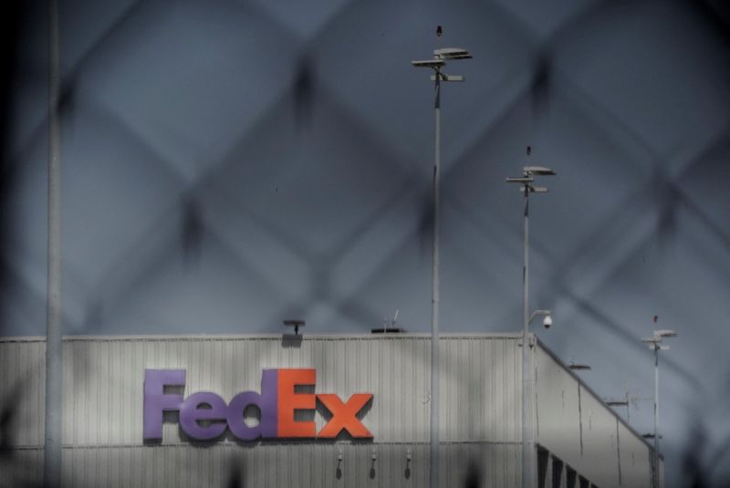 &copy; Reuters. FILE PHOTO: FedEx signage is seen through a fence at a FedEx regional hub at Los Angeles International Airport (LAX) in Los Angeles, California, U.S., September 16, 2022.  REUTERS/Bing Guan