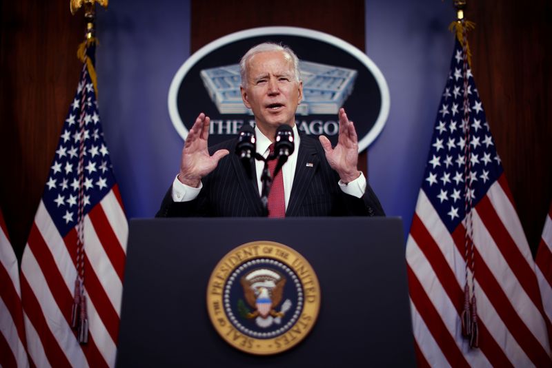 Biden signs Defense Authorization Act, but voices concerns