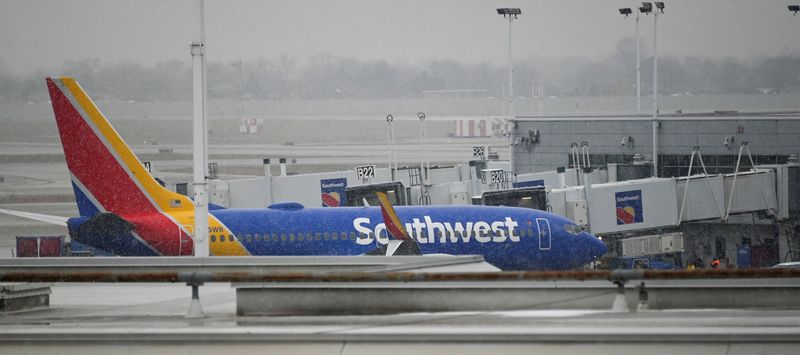 &copy; Reuters. FILE PHOTO: A plane sits on the airfield as flight cancellations mount during a cold weather front as a weather phenomenon known as a bomb cyclone hits the Upper Midwest, at Midway International Airport in Chicago, Illinois, U.S., December 22, 2022. REUTE