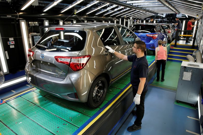 &copy; Reuters. FILE PHOTO: A Toyota Motor Corp. worker inspects a Yaris on the production line of the company's plant in Onnaing, near Valenciennes, France, May 17, 2017. REUTERS/Benoit Tessier/File Photo