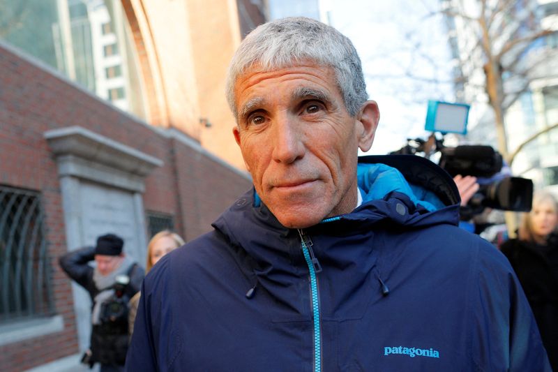 &copy; Reuters. FILE PHOTO: William "Rick" Singer leaves the federal courthouse after facing charges in a nationwide college admissions cheating scheme in Boston, Massachusetts, U.S., March 12, 2019.   REUTERS/Brian Snyder