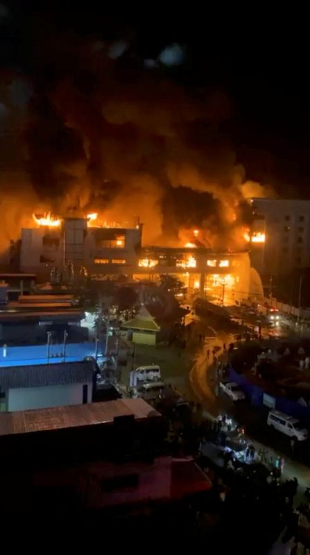 &copy; Reuters. Smoke and fire rise from buildings after a fire incident at the Grand Diamond Casino, in Poipet, Banteay Meanchhey Province, Cambodia, in this still image taken from a social media obtained on December 29, 2022. Facebook/Chaeam Noosung/via REUTERS  