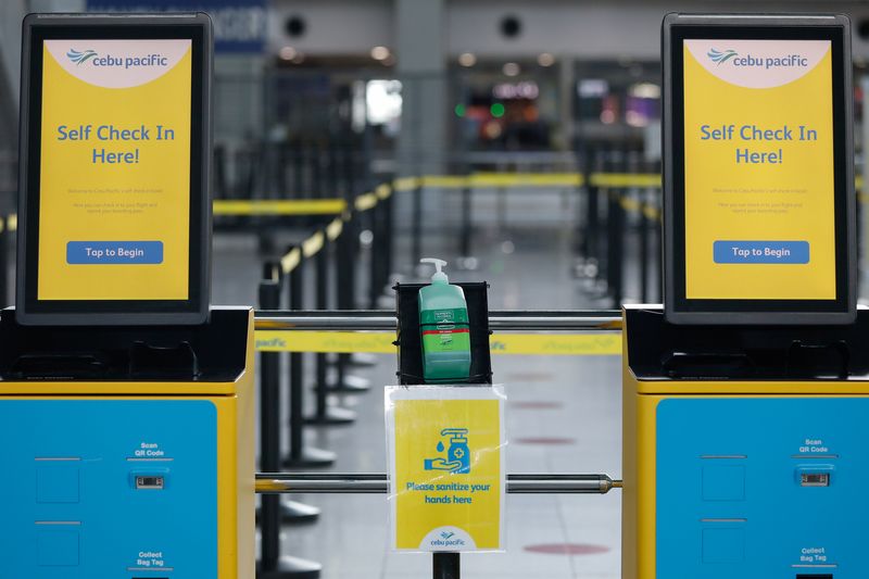 © Reuters. FILE PHOTO: Check-in counters of Cebu Pacific airline in Ninoy Aquino International Airport in Pasay City, Metro Manila, Philippines, July 9, 2020. REUTERS/Eloisa Lopez