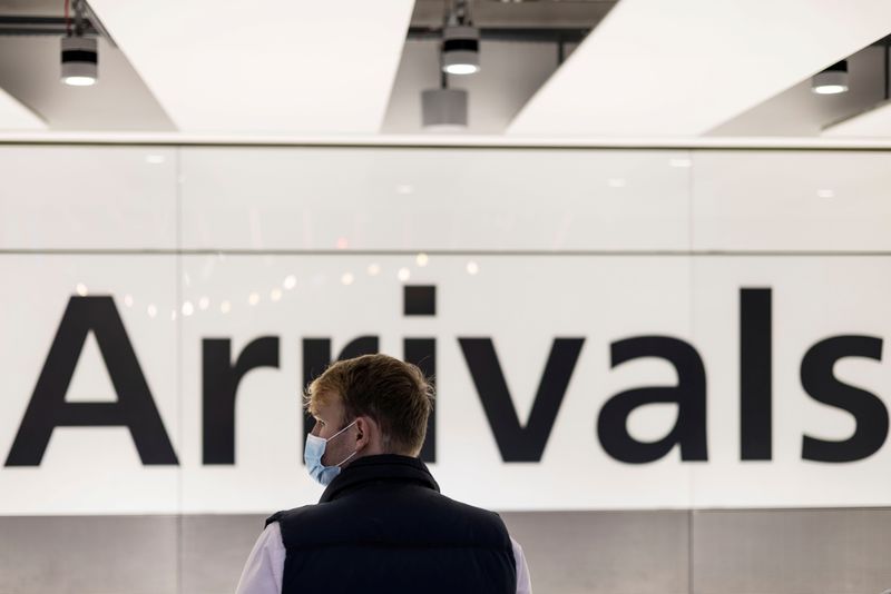 &copy; Reuters. FILE PHOTO: A man is seen waiting at the arrival area of terminal 5 following the lifting of restrictions on the entry of non-U.S. citizens imposed to help curb the spread of the coronavirus disease (COVID-19), at Heathrow International airport, in London
