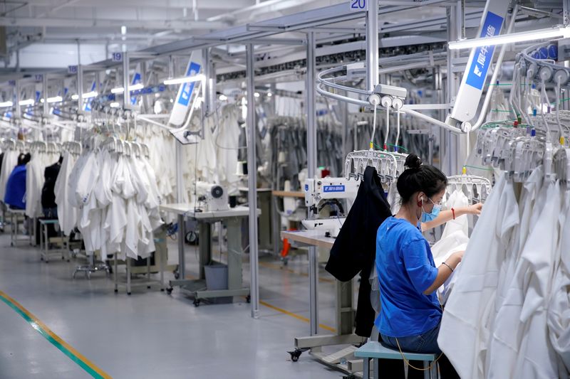 &copy; Reuters. FILE PHOTO: A worker works at Xunxi factory, which is an affiliate of Chinese e-commerce giant Alibaba, during a media tour, in Hangzhou, Zhejiang province, China November 10, 2020. REUTERS/Aly Song/File Photo