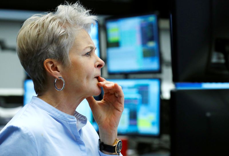 &copy; Reuters. FILE PHOTO: A trader works at Frankfurt's stock exchange in Frankfurt, Germany, March 12, 2020.    REUTERS/Ralph Orlowski