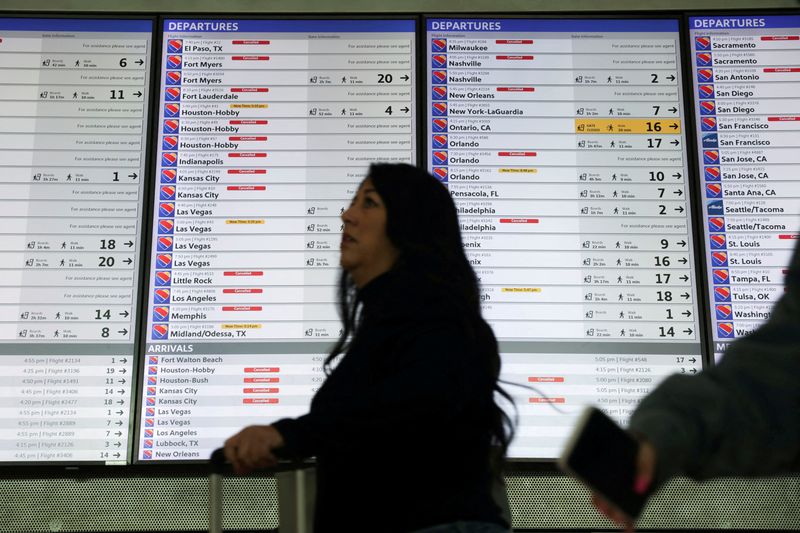 &copy; Reuters. FILE PHOTO: The departures board is overwhelmed with delayed and cancelled flights after U.S. airlines, led by Southwest, canceled thousands of flights due to a massive winter storm which swept over much of the country before and during the Christmas holi