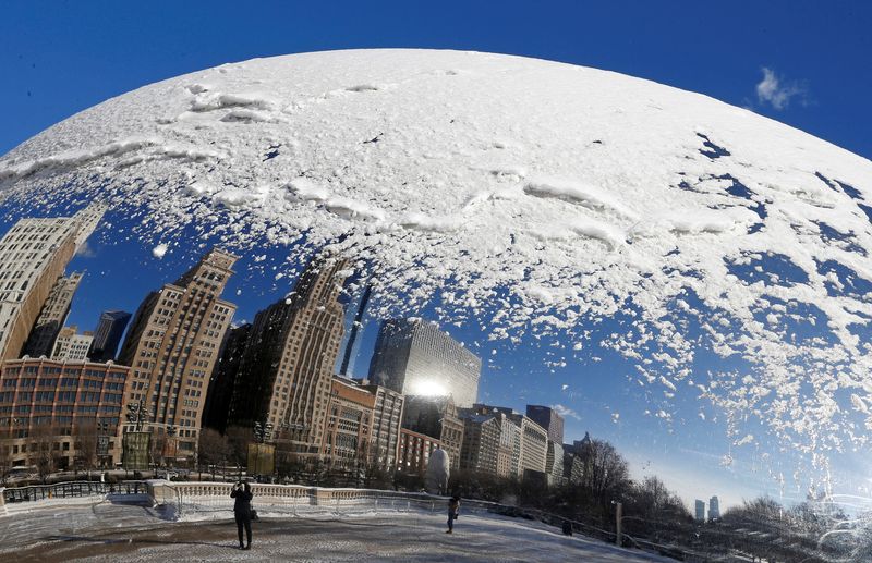 &copy; Reuters. FILE PHOTO: A woman and the Chicago skyline are reflected in the snow covered, curved surface of the "Cloud Gate" sculpture in Chicago, Illinois, January 6, 2015. A  REUTERS/Jim Young/File Photo