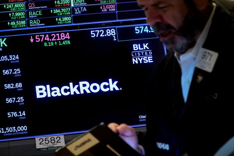 &copy; Reuters. FILE PHOTO: A trader works as a screen displays the trading information for BlackRock on the floor of the New York Stock Exchange (NYSE) in New York City, U.S., October 14, 2022. REUTERS/Brendan McDermid