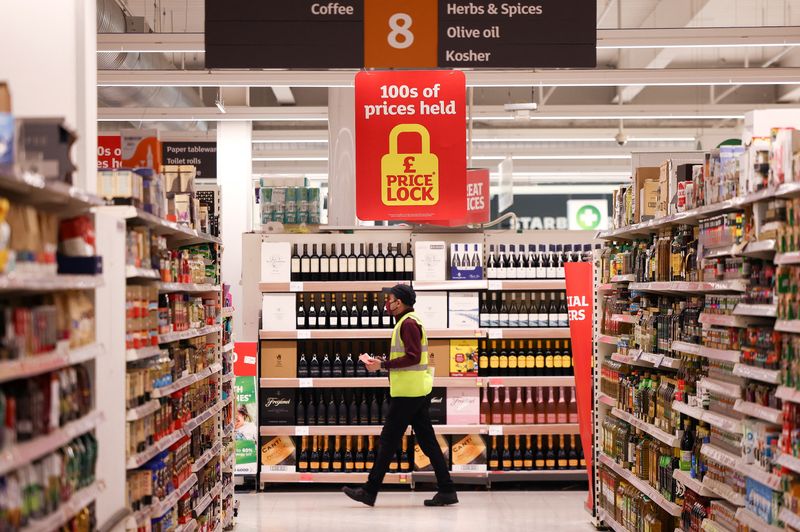 &copy; Reuters. FILE PHOTO: A employee walks inside a Sainsbury’s supermarket in Richmond, west London, Britain, June 27, 2022.  Picture taken June 27, 2022. REUTERS/Henry Nicholls